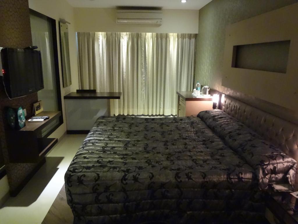 Hotel Capitol Thane Zimmer foto